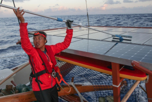Kalā Babybayan cleaning off Hikianalia’s solar panels. Dried salt forms on the panels everyday.