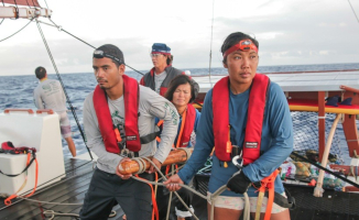 Hawaiʻi Loa and Kalā on the sweep, Kaleo checking fishing lines…