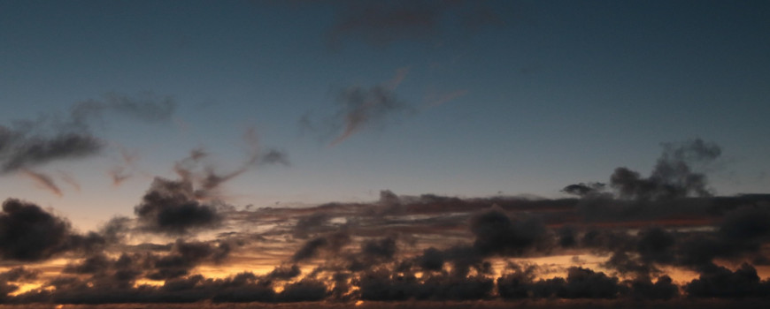 Hikianalia approaching the low lying island of Aitutaki.