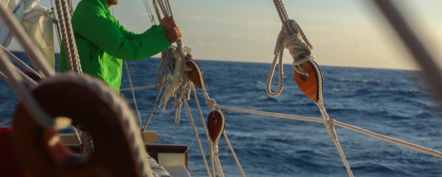 JB having a moment with the sea while on board Hōkūleʻa